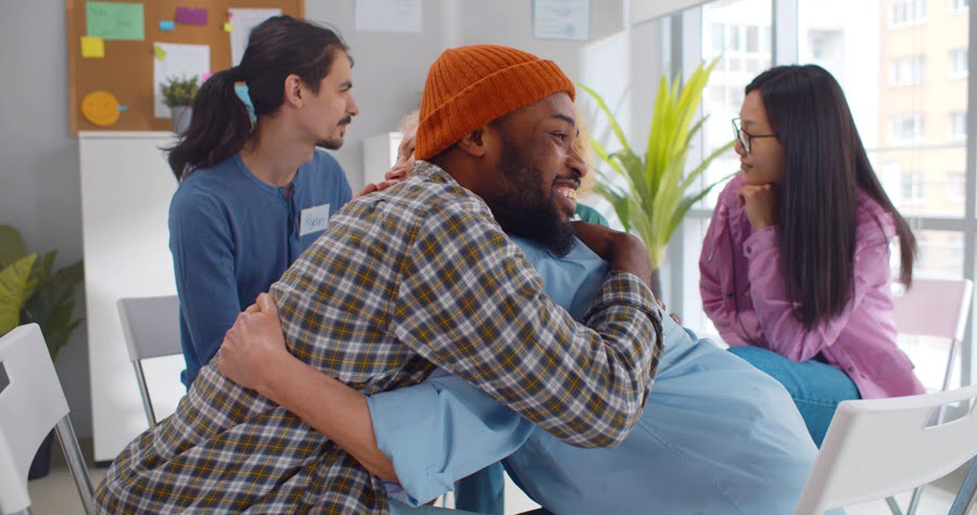 a man hugging another patient