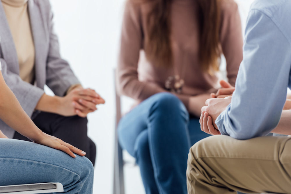 view of a small group sitting down in chairs