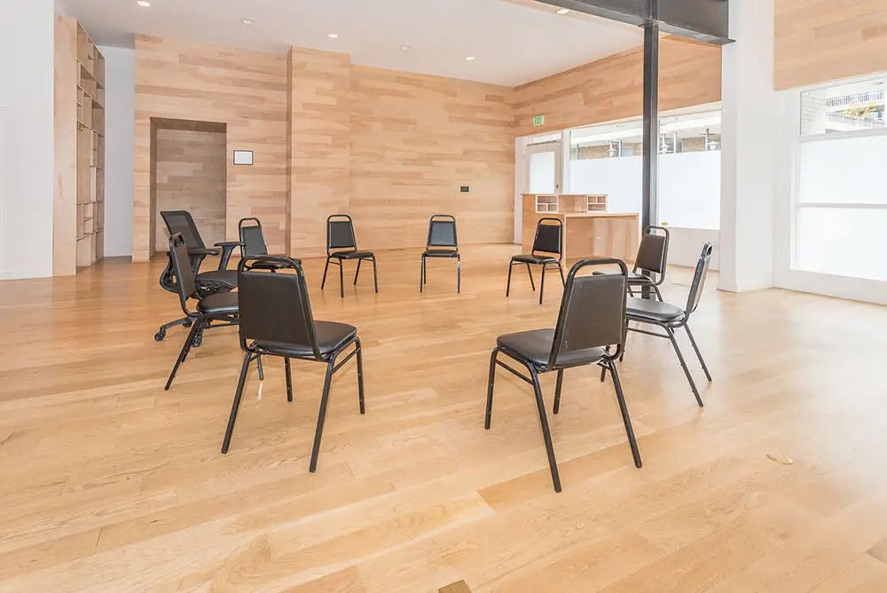 circle of empty chairs set up in group therapy room at Crestview