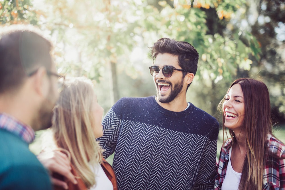 group of friends meeting and smiling