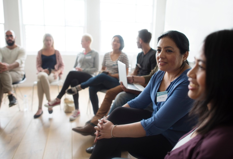 large group sitting in chairs for therapy session