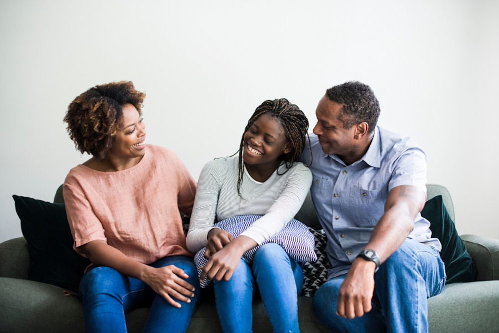 daughter sitting with parents