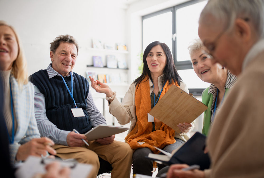 group of adults discussing addiction