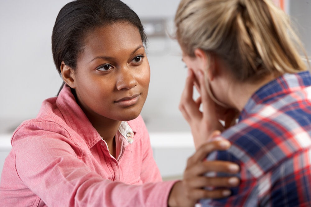 woman offering support to another