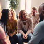 group of happy people in recovery