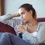 sad woman sitting in a chair