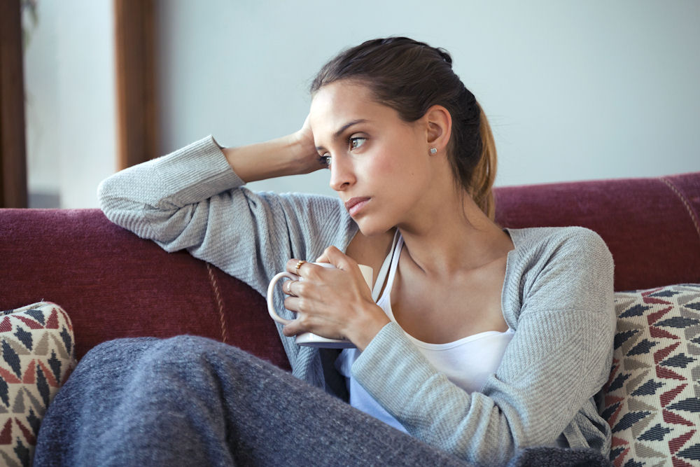 sad woman sitting in a chair