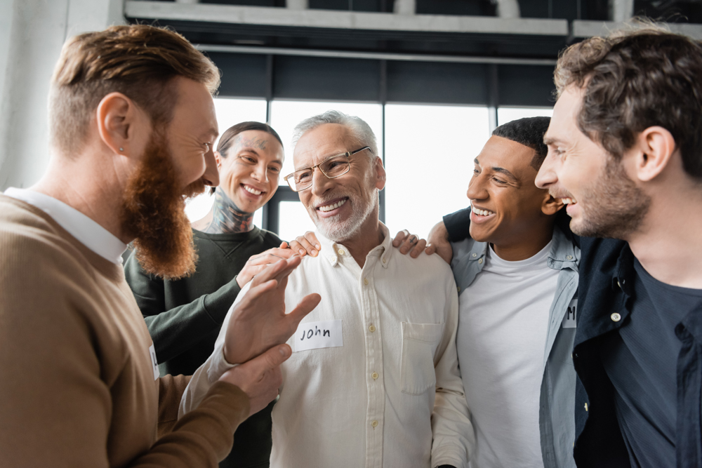 men smiling in recovery